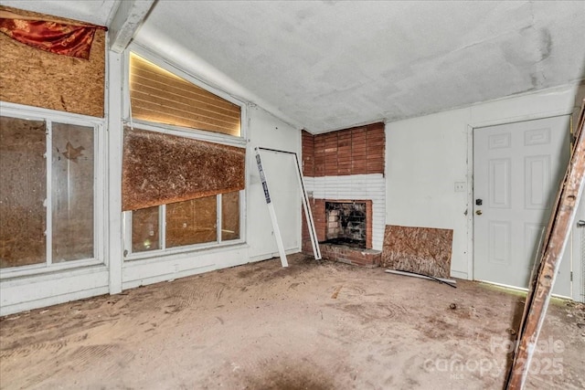714 Pine St, Hamlet, NC 28345 - unfurnished living room featuring a brick fireplace