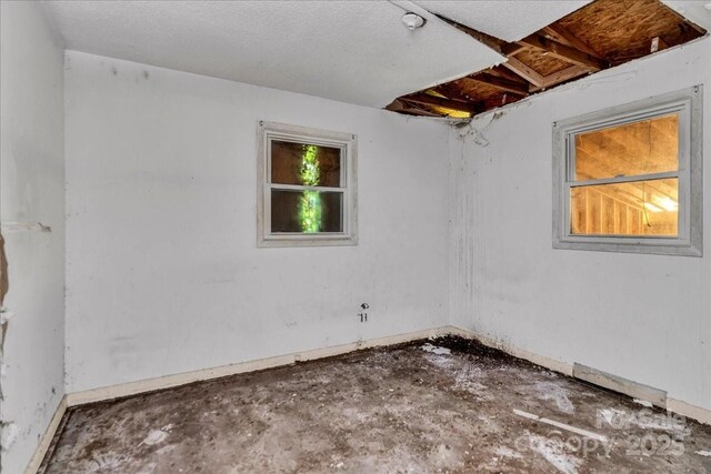 714 Pine St, Hamlet, NC 28345 - spare room featuring baseboards
