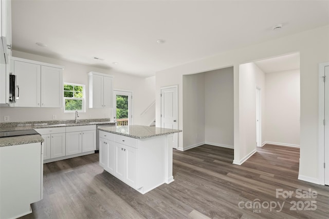 510 3rd St, Salisbury, NC 28144 - kitchen with appliances with stainless steel finishes, dark wood finished floors, and white cabinetry