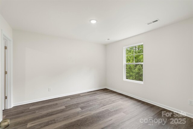 510 3rd St, Salisbury, NC 28144 - unfurnished room featuring dark wood-style flooring, baseboards, and recessed lighting
