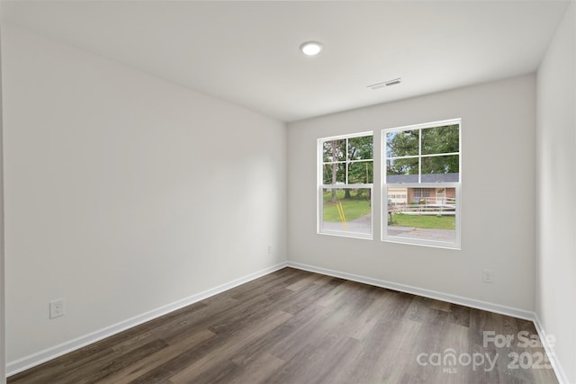 510 3rd St, Salisbury, NC 28144 - spare room with dark wood-type flooring and baseboards