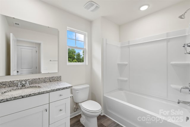 510 3rd St, Salisbury, NC 28144 - full bath featuring vanity, wood finished floors, toilet, shower / bathtub combination, and baseboards