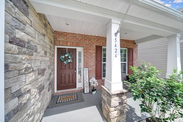 5424 Tilley Manor Dr, Matthews, NC 28105 - entrance to property featuring brick siding, stone siding, and covered porch