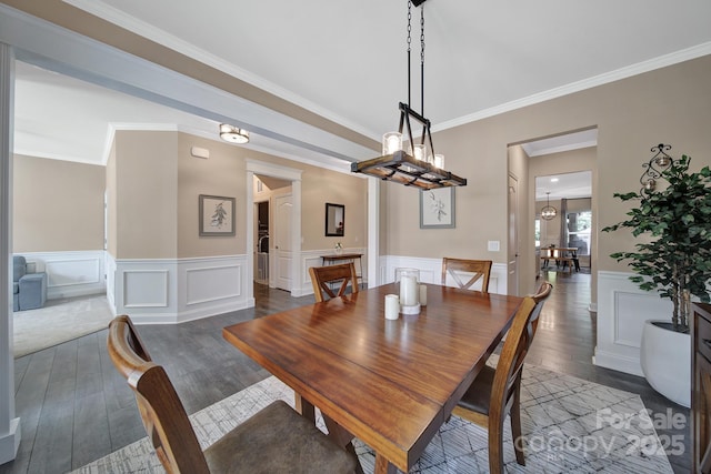 5424 Tilley Manor Dr, Matthews, NC 28105 - dining room with dark wood finished floors, crown molding, wainscoting, and a decorative wall
