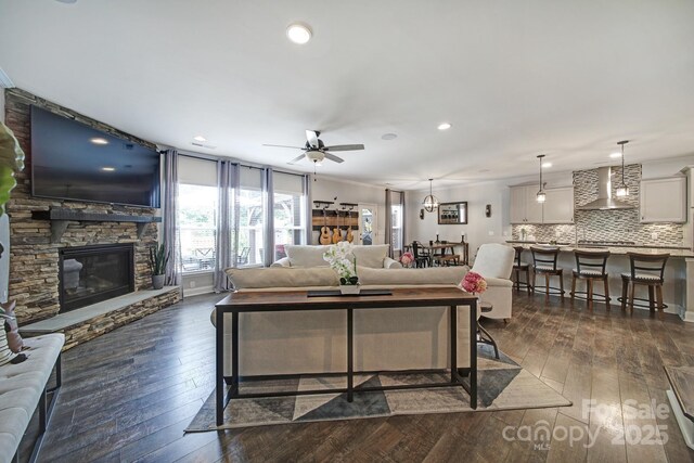 5424 Tilley Manor Dr, Matthews, NC 28105 - living area featuring recessed lighting, ceiling fan, a fireplace, and dark wood-type flooring