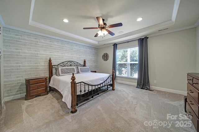 5424 Tilley Manor Dr, Matthews, NC 28105 - carpeted bedroom featuring a raised ceiling, recessed lighting, ornamental molding, and ceiling fan