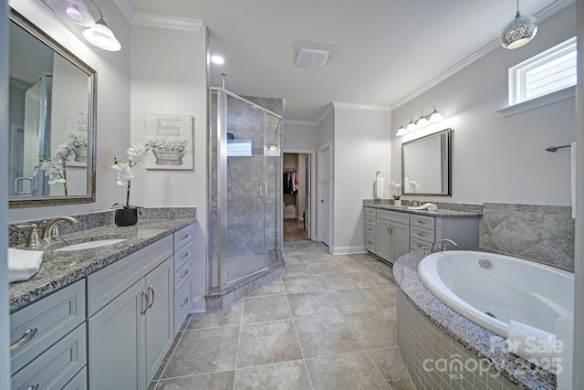 5424 Tilley Manor Dr, Matthews, NC 28105 - bathroom featuring a shower stall, two vanities, ornamental molding, a bath, and tile patterned flooring