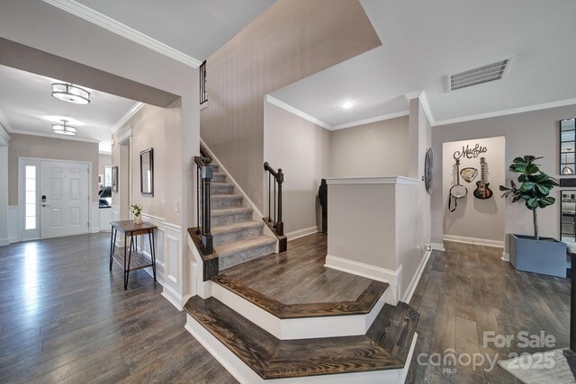 5424 Tilley Manor Dr, Matthews, NC 28105 - foyer with dark wood-style flooring, crown molding, and stairway