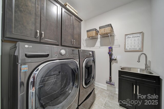 5424 Tilley Manor Dr, Matthews, NC 28105 - washroom with washer and clothes dryer, cabinet space, and light tile patterned floors