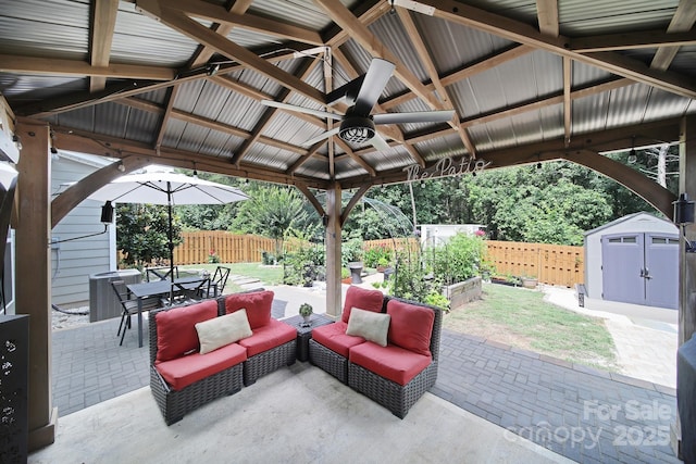 5424 Tilley Manor Dr, Matthews, NC 28105 - fenced backyard featuring a gazebo, a storage shed, a patio area, a ceiling fan, and outdoor dining area