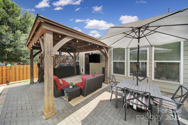 5424 Tilley Manor Dr, Matthews, NC 28105 - view of patio / terrace with a gazebo, an outdoor hangout area, outdoor dining area, grilling area, and a ceiling fan