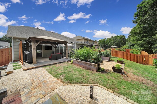 5424 Tilley Manor Dr, Matthews, NC 28105 - view of yard with a gazebo, a garden, a patio, and outdoor lounge area