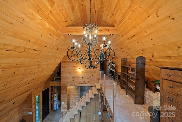 193 Falls View Dr, Lake Toxaway, NC 28747 - staircase featuring wooden ceiling, a chandelier, lofted ceiling, and wood walls