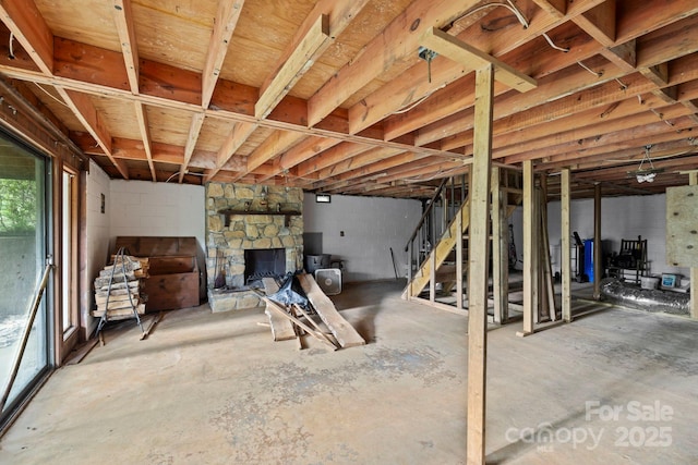 193 Falls View Dr, Lake Toxaway, NC 28747 - below grade area featuring stairway, a fireplace, and concrete block wall
