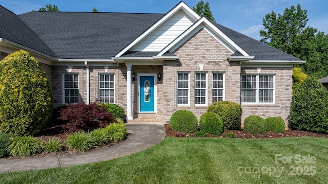 179 Browning Dr, Taylorsville, NC 28681 - view of front of home featuring a front yard, brick siding, and entry steps