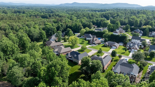 179 Browning Dr, Taylorsville, NC 28681 - aerial view of property's location featuring a forest, nearby suburban area, and mountains