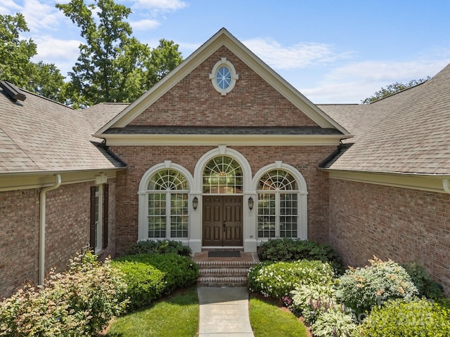 1629 Southpoint Ln, New London, NC 28127 - property entrance with a shingled roof and brick siding
