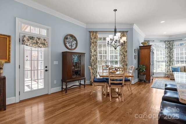 1629 Southpoint Ln, New London, NC 28127 - dining room featuring a chandelier, light wood-style flooring, crown molding, baseboards, and recessed lighting