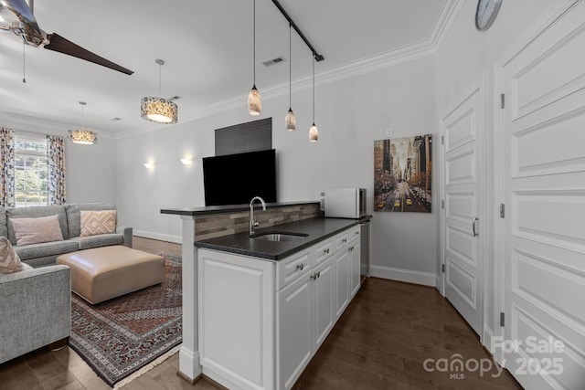 1629 Southpoint Ln, New London, NC 28127 - kitchen with a sink, open floor plan, dark countertops, a peninsula, and ceiling fan