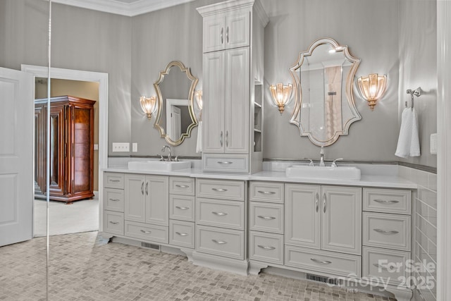 1629 Southpoint Ln, New London, NC 28127 - bathroom featuring double vanity, tile patterned floors, and ornamental molding