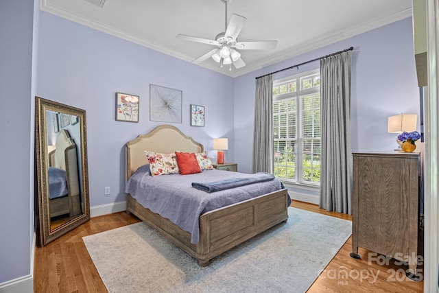1629 Southpoint Ln, New London, NC 28127 - bedroom featuring ornamental molding, wood finished floors, a ceiling fan, and baseboards
