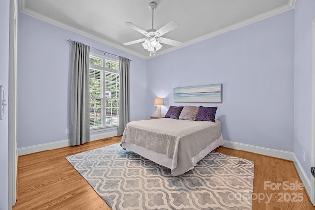 1629 Southpoint Ln, New London, NC 28127 - bedroom with ornamental molding, light wood-style floors, baseboards, and ceiling fan