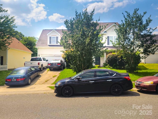 3509 Joel Turner Dr, Charlotte, NC 28216 - view of property hidden behind natural elements with concrete driveway