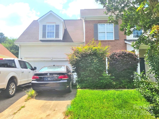 3509 Joel Turner Dr, Charlotte, NC 28216 - view of front facade with driveway and brick siding