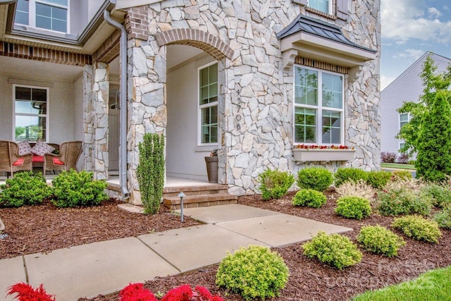 13708 Huntson Park Ln, Huntersville, NC 28078 - view of exterior entry with stone siding and covered porch