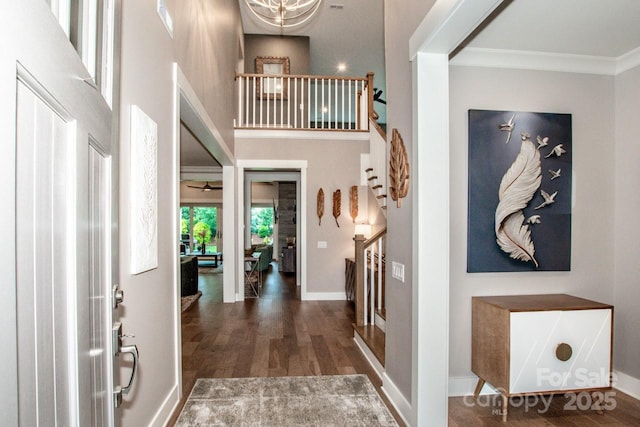 13708 Huntson Park Ln, Huntersville, NC 28078 - foyer with stairway, wood finished floors, a high ceiling, and ornamental molding