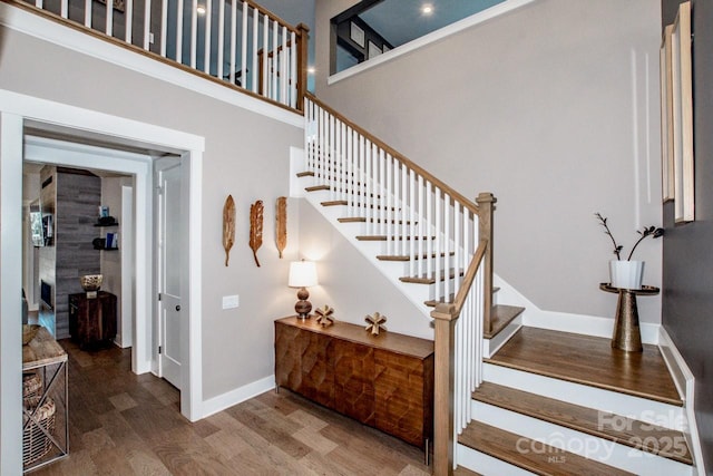 13708 Huntson Park Ln, Huntersville, NC 28078 - stairway featuring wood finished floors and a towering ceiling