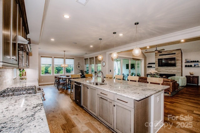 13708 Huntson Park Ln, Huntersville, NC 28078 - kitchen with a spacious island, dark wood finished floors, light stone counters, crown molding, and open floor plan