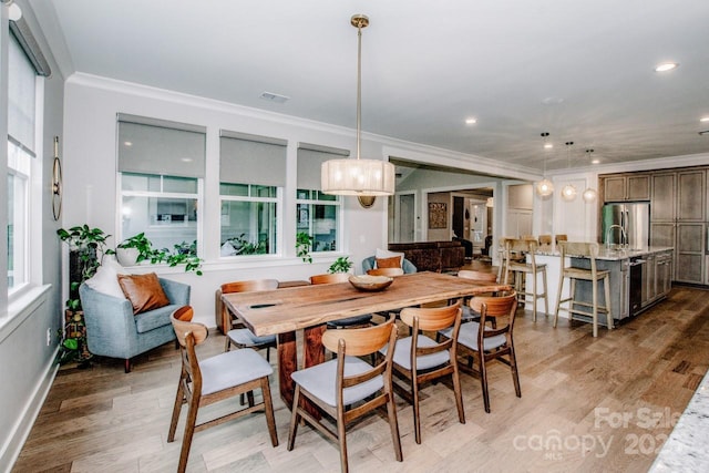 13708 Huntson Park Ln, Huntersville, NC 28078 - dining room featuring crown molding, light wood-type flooring, and recessed lighting