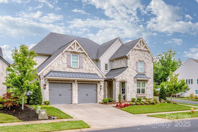 13708 Huntson Park Ln, Huntersville, NC 28078 - view of front of home with driveway, a garage, stone siding, a standing seam roof, and a front yard