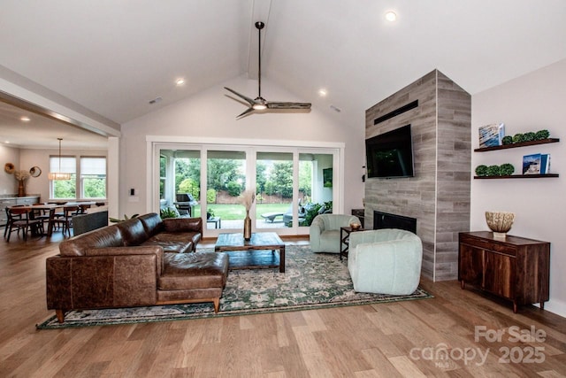13708 Huntson Park Ln, Huntersville, NC 28078 - living area with beamed ceiling, high vaulted ceiling, wood finished floors, a fireplace, and recessed lighting