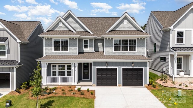 18019 Wilbanks Dr, Charlotte, NC 28278 - view of front of home featuring roof with shingles, a porch, driveway, and board and batten siding