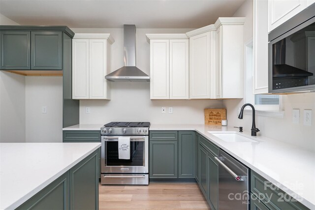 18019 Wilbanks Dr, Charlotte, NC 28278 - kitchen with wall chimney exhaust hood, stainless steel appliances, a sink, and light countertops