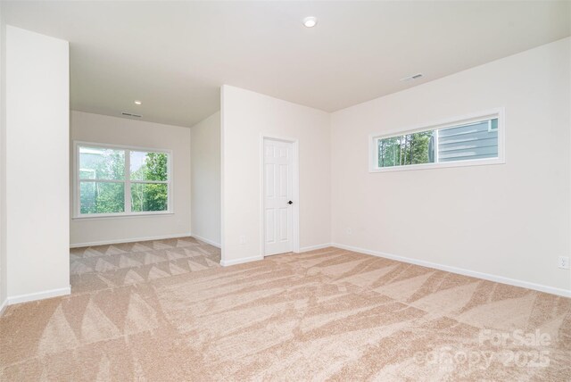 18019 Wilbanks Dr, Charlotte, NC 28278 - carpeted empty room featuring healthy amount of natural light, baseboards, and recessed lighting