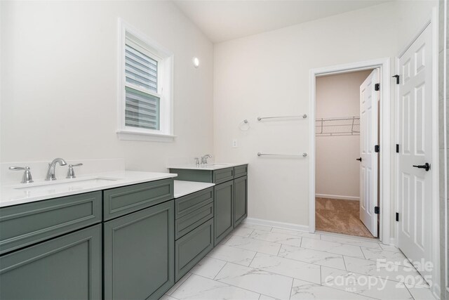 18019 Wilbanks Dr, Charlotte, NC 28278 - full bathroom featuring marble look tiles, vanity, a spacious closet, and baseboards