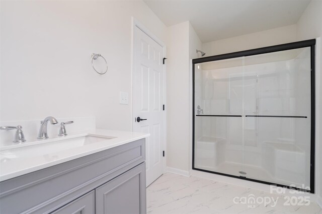 18019 Wilbanks Dr, Charlotte, NC 28278 - bathroom featuring marble finish flooring, a shower stall, and vanity