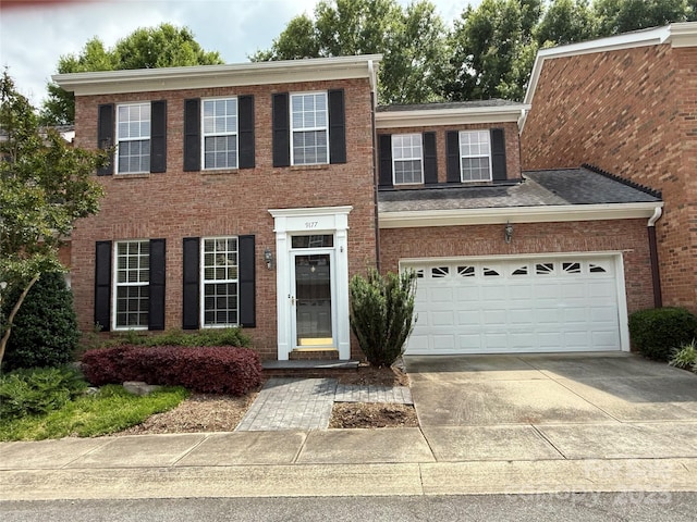 9177 Bonnie Briar Cir, Charlotte, NC 28277 - view of front of property featuring driveway, brick siding, and a garage