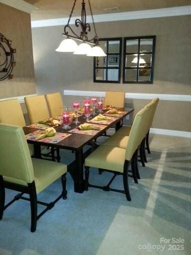 9177 Bonnie Briar Cir, Charlotte, NC 28277 - dining area with crown molding and carpet floors