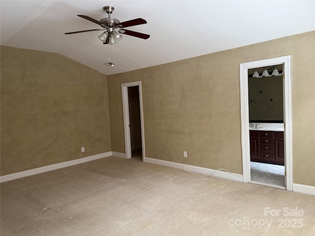 9177 Bonnie Briar Cir, Charlotte, NC 28277 - unfurnished bedroom featuring light carpet, vaulted ceiling, ensuite bathroom, and ceiling fan