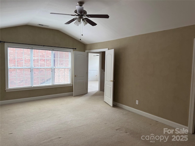9177 Bonnie Briar Cir, Charlotte, NC 28277 - unfurnished bedroom with light carpet, lofted ceiling, baseboards, and ceiling fan