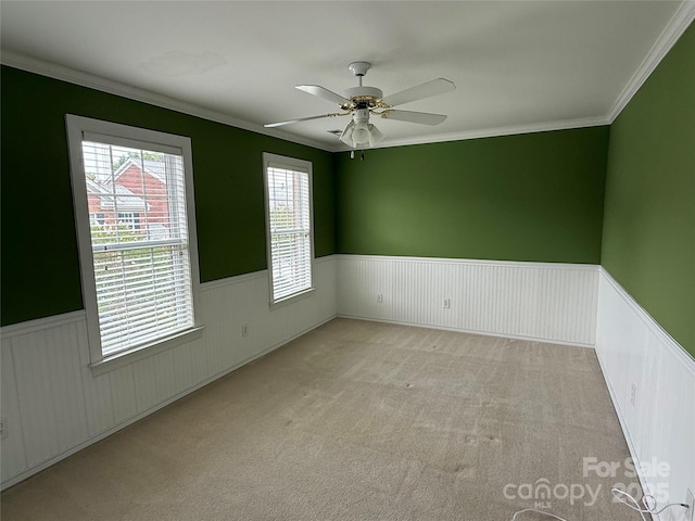 9177 Bonnie Briar Cir, Charlotte, NC 28277 - carpeted spare room with wainscoting, ceiling fan, and crown molding