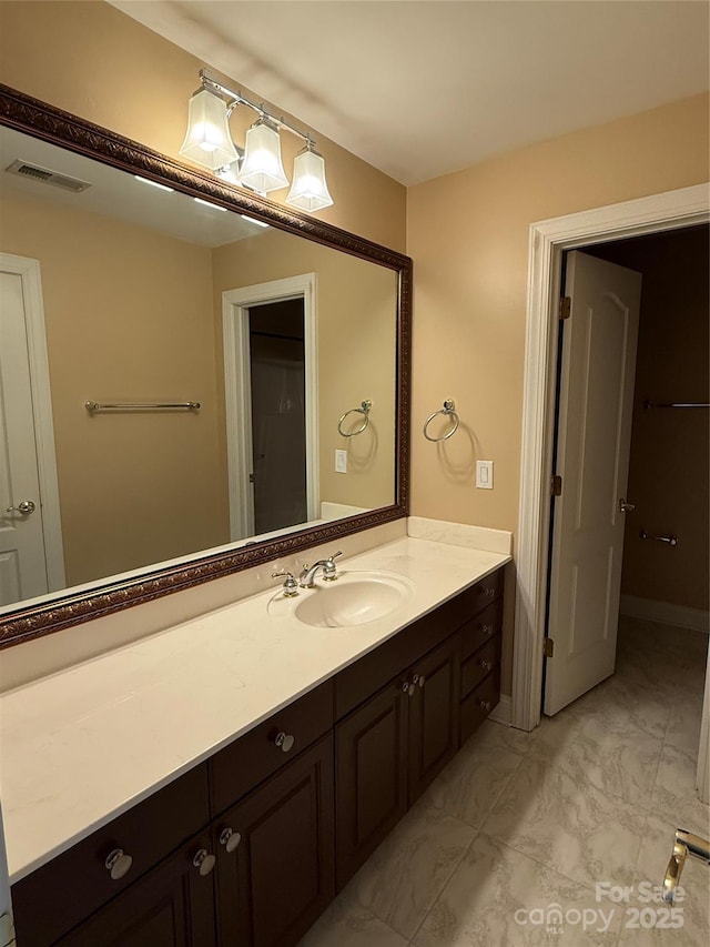 9177 Bonnie Briar Cir, Charlotte, NC 28277 - bathroom with vanity and marble look tiles