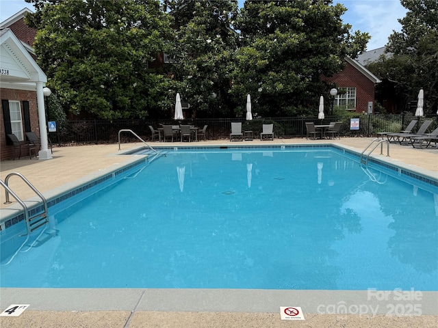 9177 Bonnie Briar Cir, Charlotte, NC 28277 - community pool with a patio area and outdoor dining space