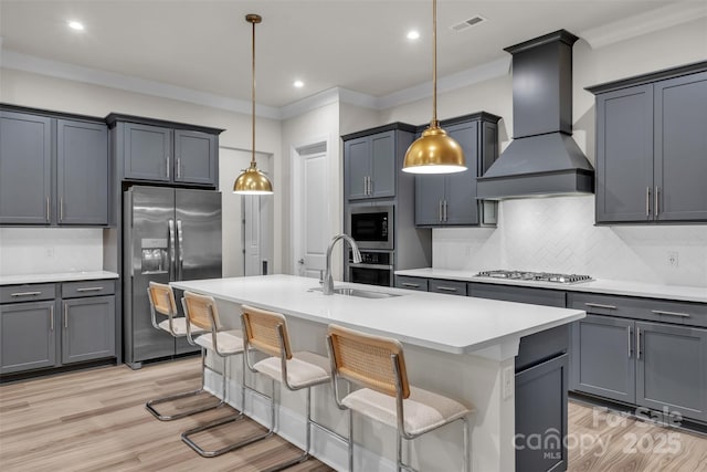 513 Meadow Ridge Dr, Belmont, NC 28012 - kitchen featuring stainless steel appliances, a sink, premium range hood, light wood finished floors, and ornamental molding