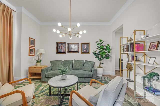513 Meadow Ridge Dr, Belmont, NC 28012 - living room with a chandelier, wood finished floors, ornamental molding, and baseboards