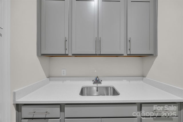 513 Meadow Ridge Dr, Belmont, NC 28012 - kitchen featuring gray cabinets, a sink, and light countertops